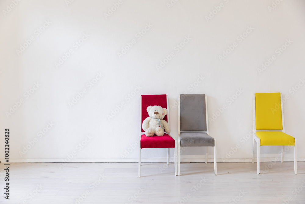 Fototapeta premium Three old vintage chairs in the interior of an empty white room