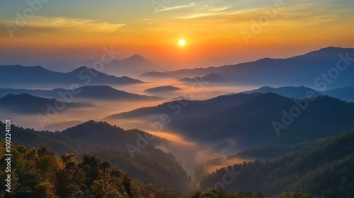 A serene view of the sunrise over Doi Inthanon, with the mist rising from the valleys below.