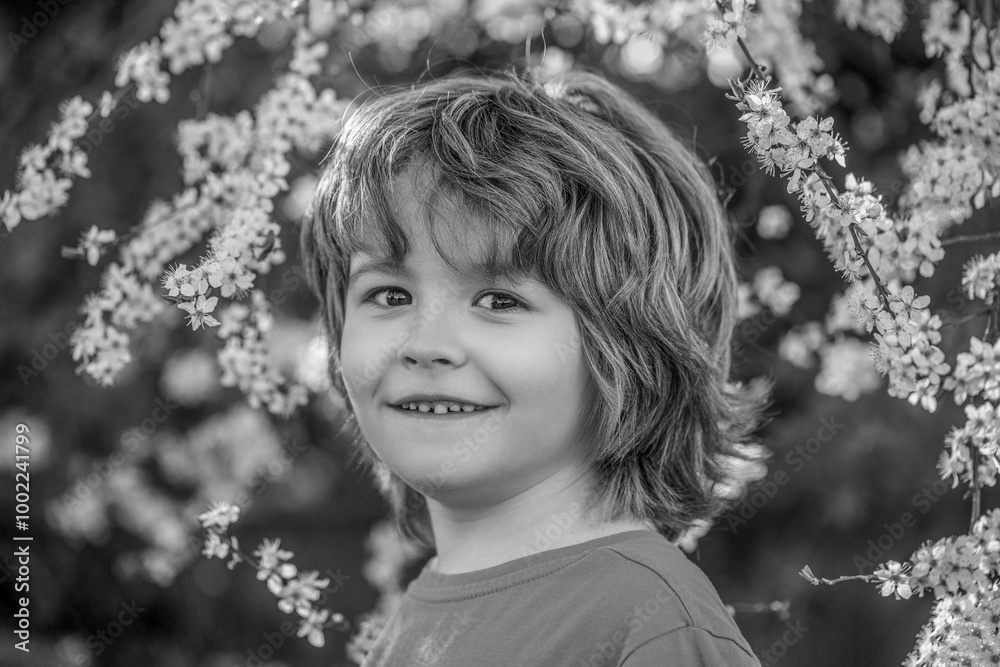 Happy little boy walking in spring garden. Spring activity for inquisitive children. Black and white Happy little boy walking in spring garden. Spring activity for inquisitive children. Black and white