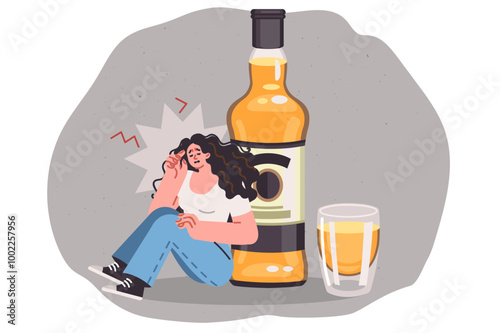 Drunk woman feels headache and hangover while sitting near large bottle of beer or whiskey