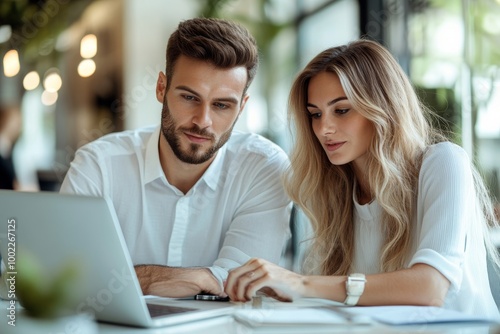 Young business couple working and discussing by laptop in the office, Generative AI