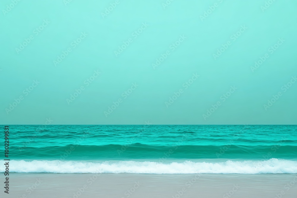 Fototapeta premium Tranquil ocean view with turquoise waters against a pastel sky.