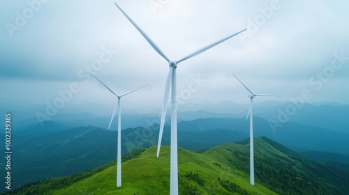 Wind Turbines on Green Hills Under Cloudy Sky