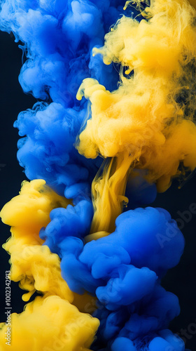 Blue and yellow smoke on black background photo