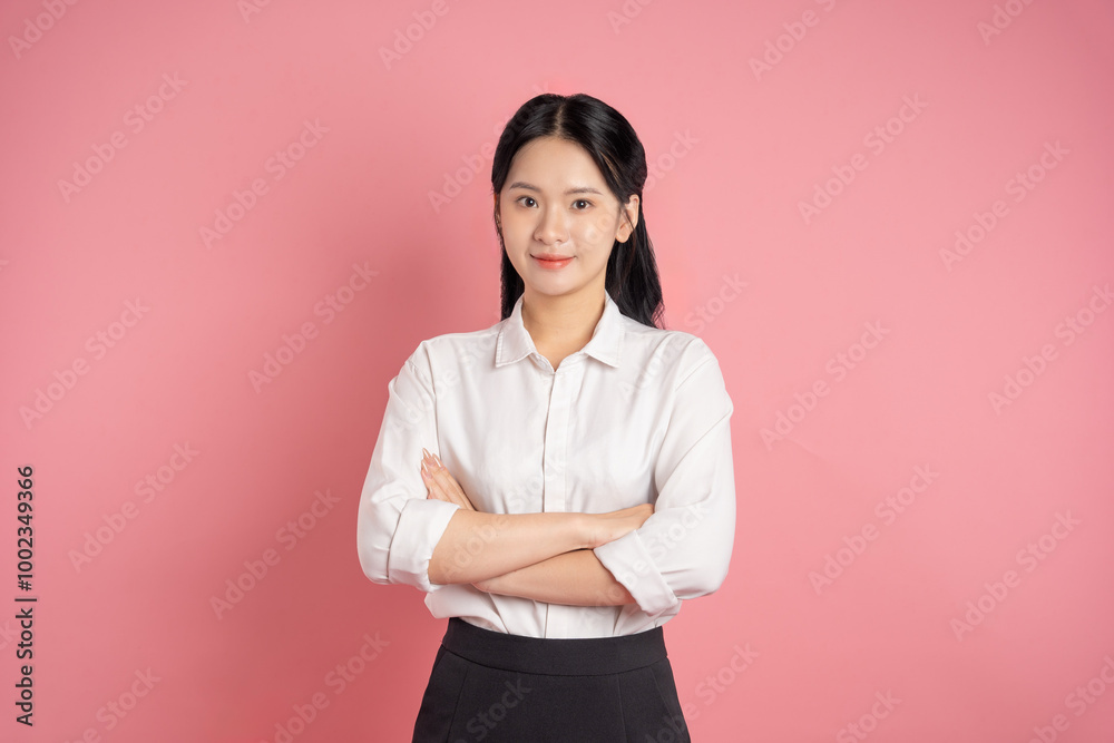 portrait of Asian business woman posing on pink background portrait of Asian business woman posing on pink background