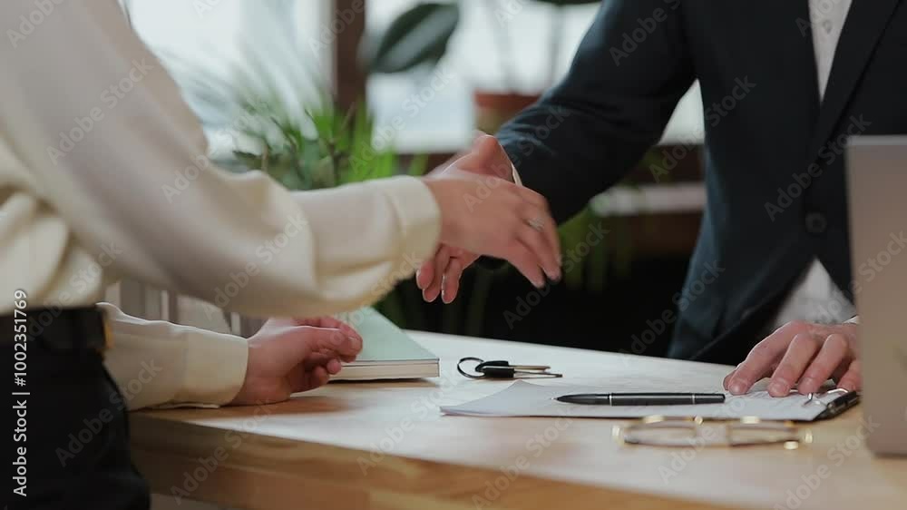 Woman sign mortgage contract, put signature on sale purchase rental agreement, handshaking realtor at meeting with estate agent, satisfied customers buy property, get keys of new home.