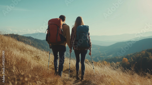 Loving mid aged couple with a backapacks hiking on the hills together 