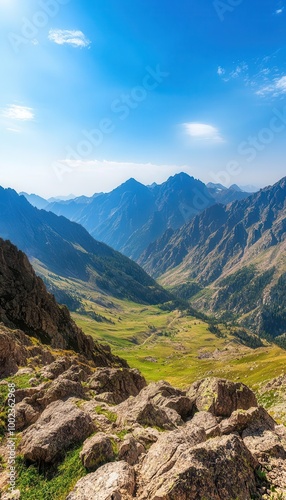 Expansive mountain range with jagged peaks and rolling hills, captured in a panoramic view Bright natural light, clear sky, sharp focus on rocky textures and details