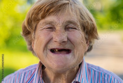 Old woman without teeth. Selective focus.