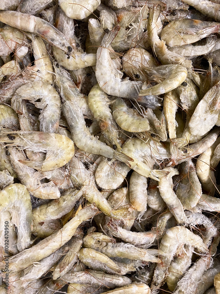 Lots of frozen unpeeled shrimp top view Lots of frozen unpeeled shrimp top view