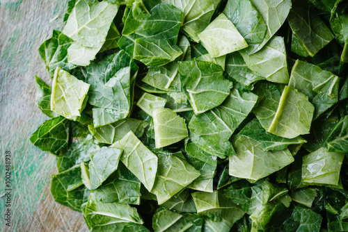 Freshly chopped collard greens ready for cooking in a kitchen setting