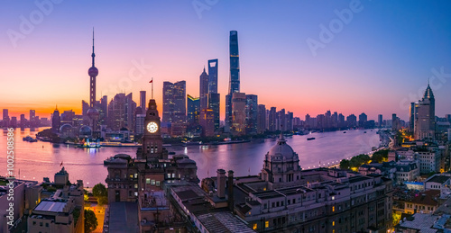 Aerial view of modern city skyline and buildings at sunrise in Shanghai