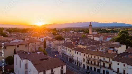 the sun sets over a town in italy photo