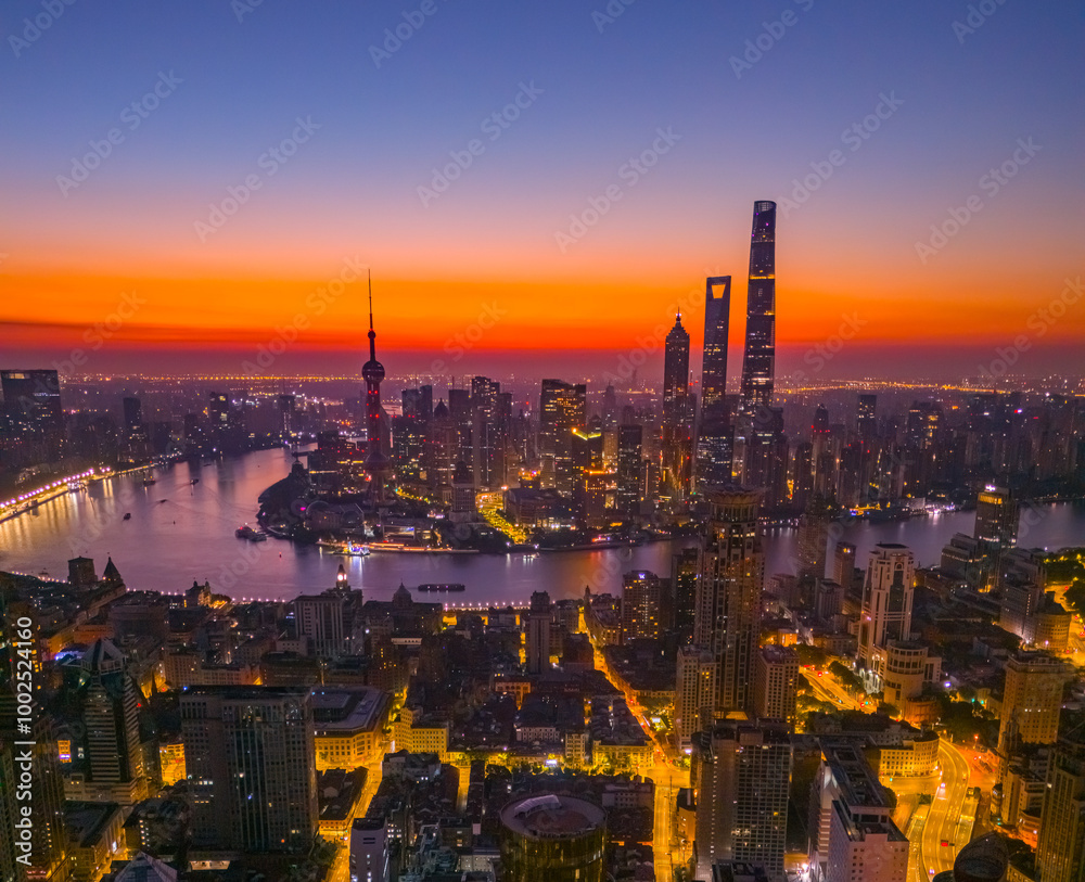 Obraz premium Aerial view of modern city skyline and buildings at sunrise in Shanghai