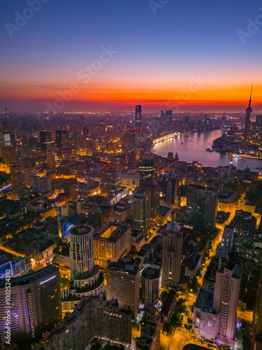 Aerial view of modern city skyline and buildings at sunrise in Shanghai