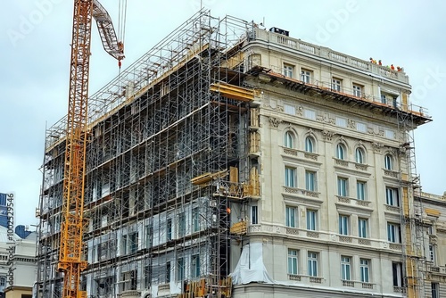 Large Hotel Building Undergoing Mid Renovation with Scaffolding