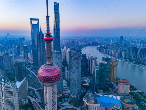 Aerial view of modern city skyline and buildings at sunrise in Shanghai