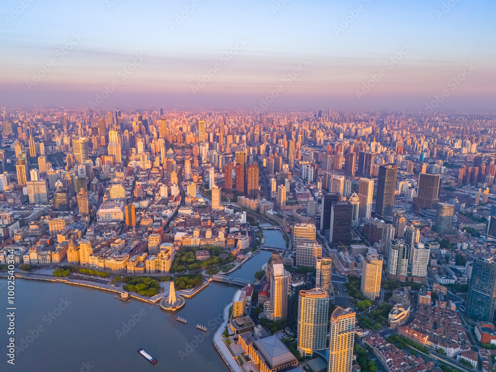 Fototapeta premium Aerial view of modern city skyline and buildings at sunrise in Shanghai