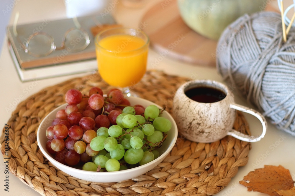 Pumpkins, various food and drinks, fall decorations, books and candles on the table. Fall hygge at home. Selective focus. Pumpkins, various food and drinks, fall decorations, books and candles on the table. Fall hygge at home. Selective focus.