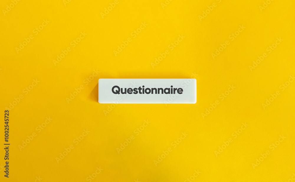 Questionnaire. Text on Block Letter Tile on Yellow Background. Minimal Aesthetic. Questionnaire. Text on Block Letter Tile on Yellow Background. Minimal Aesthetic.
