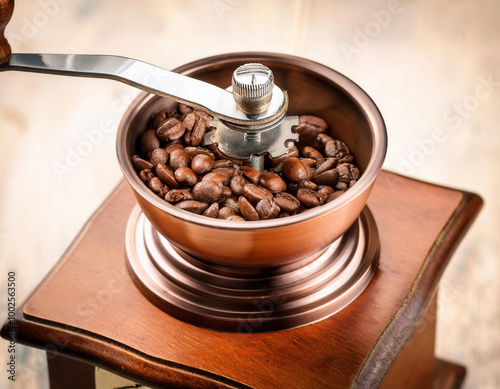 Obraz na płótnie A vintage-style manual coffee grinder filled with fresh coffee beans, elegantly placed in a minimalist composition with a white background. w salonie