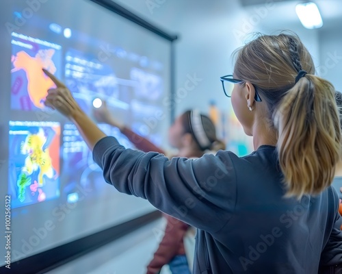 Teachers and workers using interactive smart boards and digital tablets to enhance learning and engagement photo
