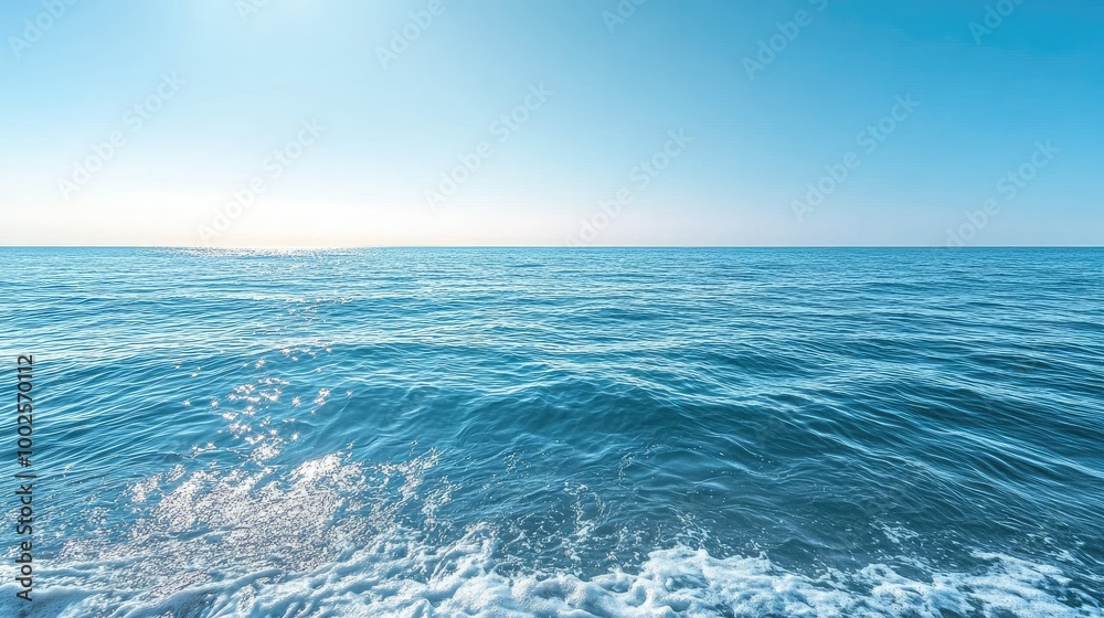 Fototapeta premium Serene Ocean Waves Under a Clear Blue Sky