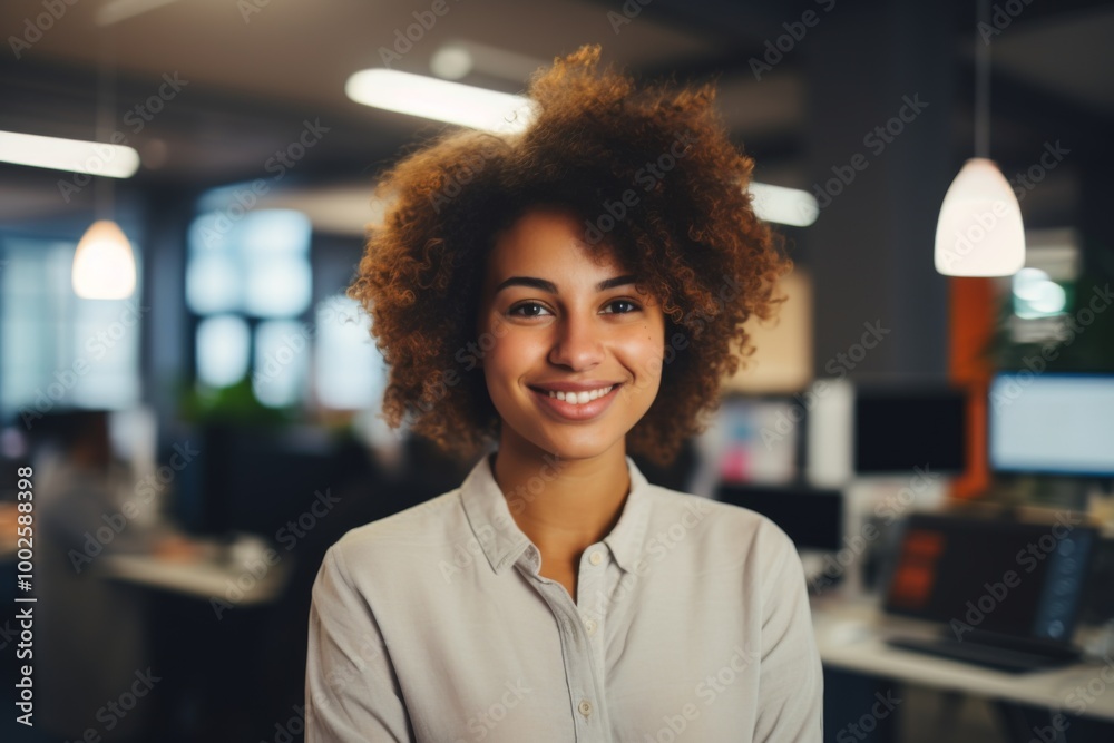 Smiling portrait of a young hipster African American woman in office Smiling portrait of a young hipster African American woman in office