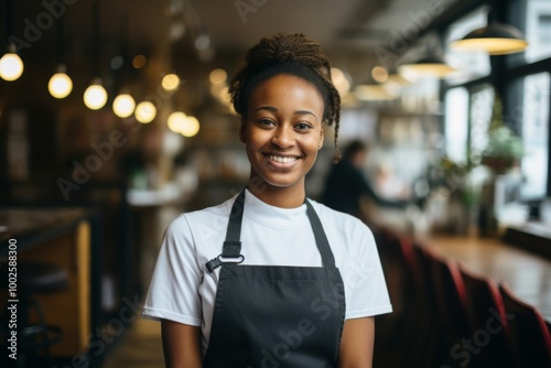 Smiling portrait of a young female African American waitress