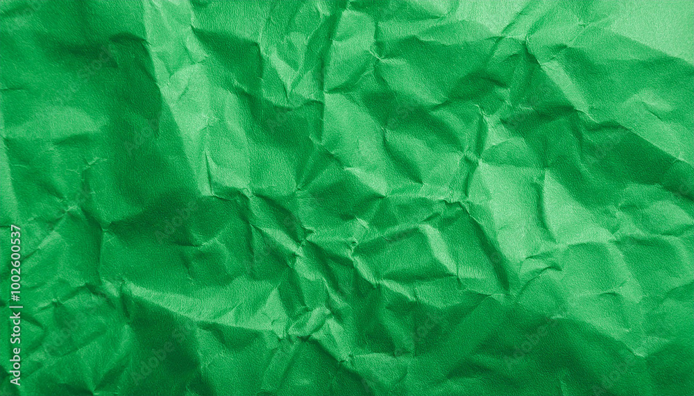 Crumpled green paper background. Creative abstract texture for your design.