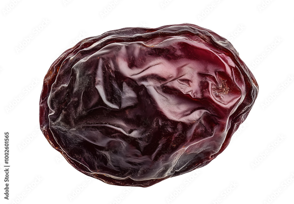 A single dried red prune showcasing its rich texture against a bright white background A single dried red prune showcasing its rich texture against a bright white background
