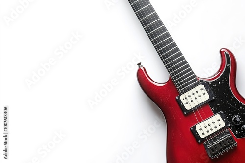 Red electric guitar on white with copy space