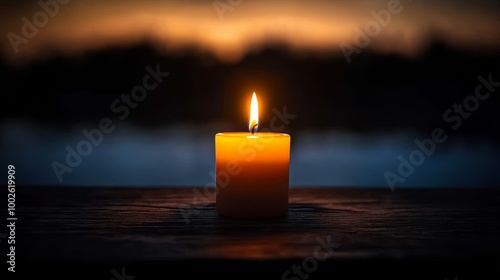 Serene Reflection: Contemplative Person by Yahrzeit Candle in Tranquil Garden Setting with Lush Greenery Background photo