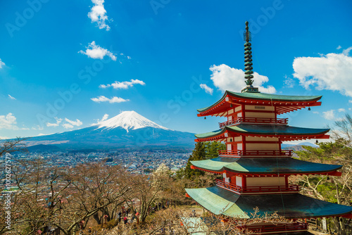 Red pagoda Shimoyoshida shrine with snow on Fuji mountain