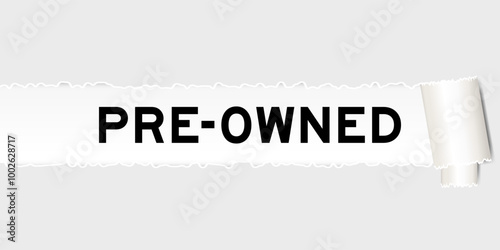 Ripped gray paper background that have word pre-owned under torn part