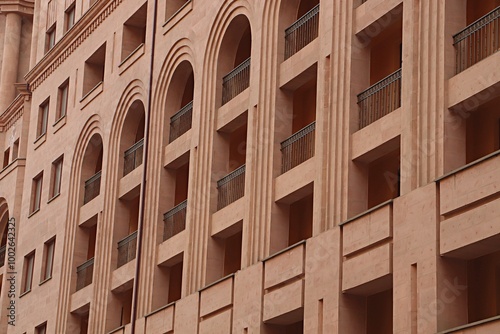 Residential building in the center of Yerevan with walls made of pink tuff facing slabs