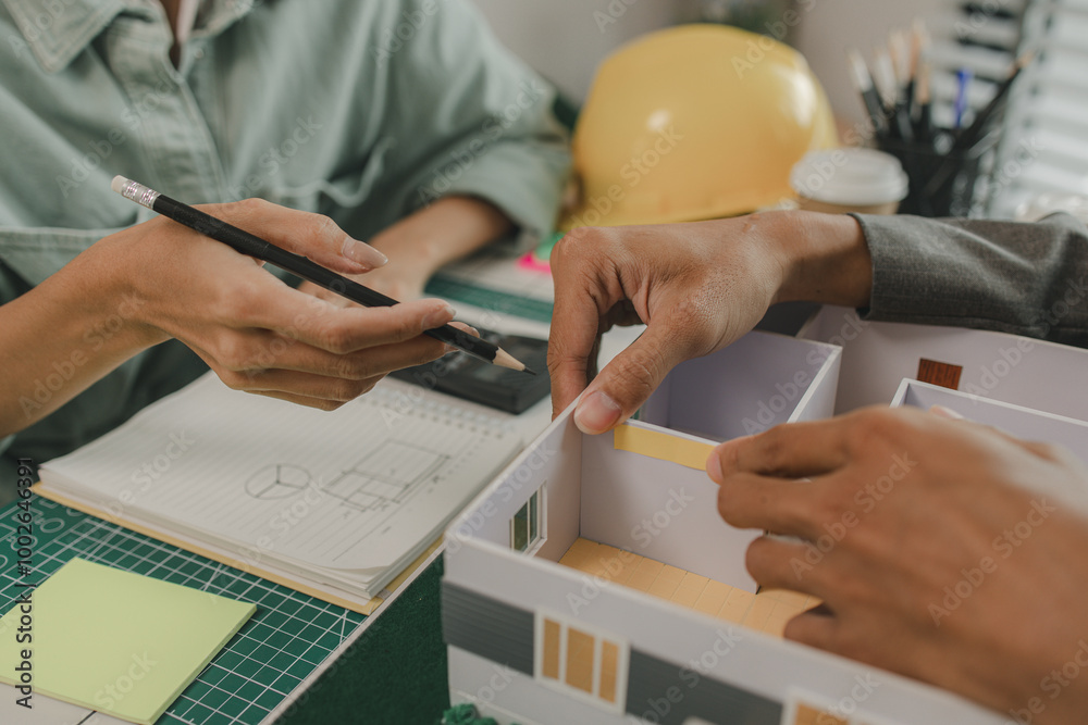 engineer and investor are negotiating the details of a housing project ...