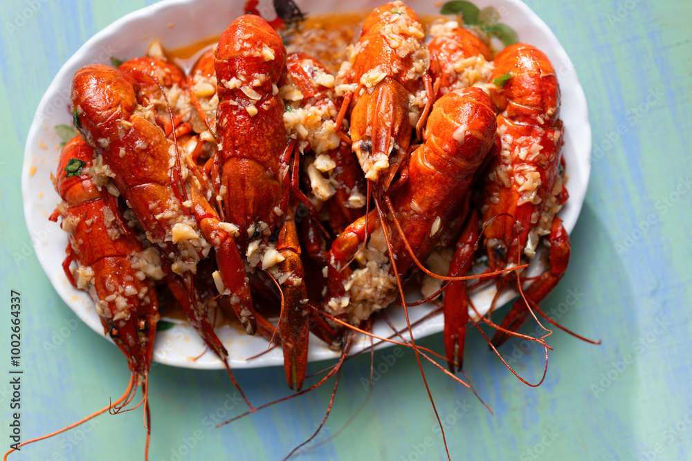 plate of traditional garlicky spicy sichuan red crawfish