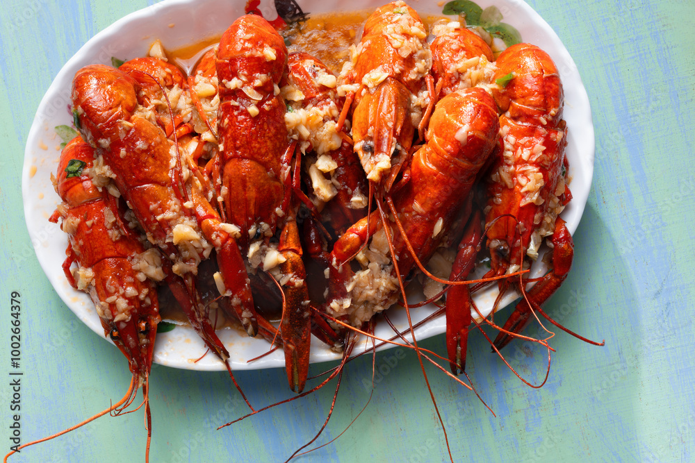 plate of traditional garlicky spicy sichuan red crawfish