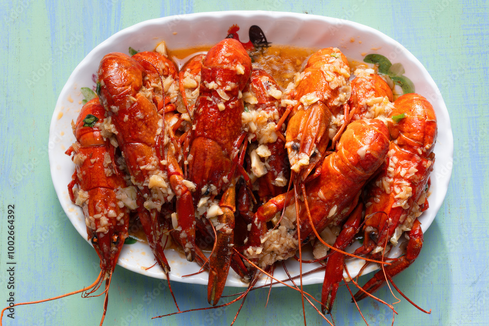 plate of traditional garlicky spicy sichuan red crawfish