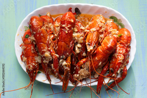 plate of traditional garlicky spicy sichuan red crawfish