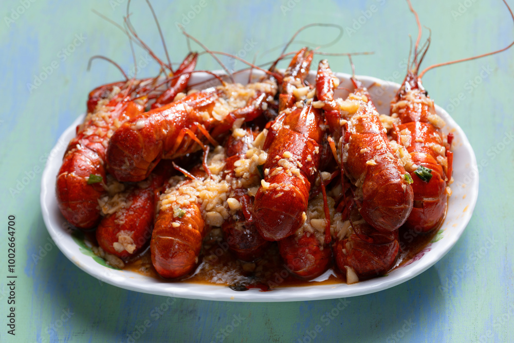 plate of traditional garlicky spicy sichuan red crawfish