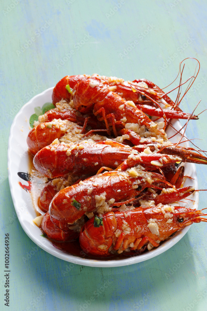 plate of traditional garlicky spicy sichuan red crawfish