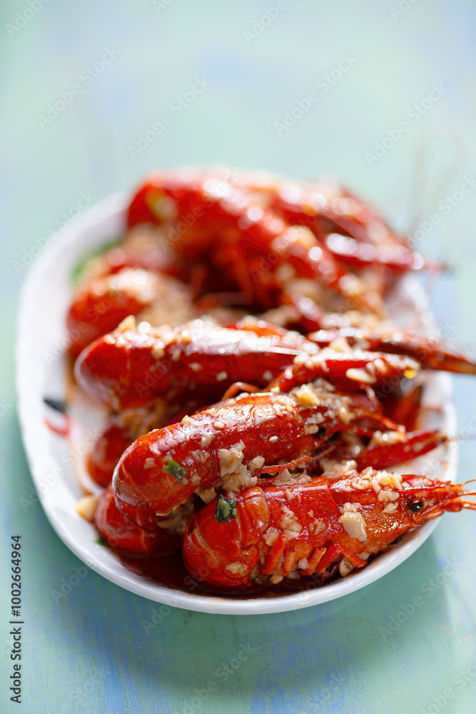 plate of traditional garlicky spicy sichuan red crawfish
