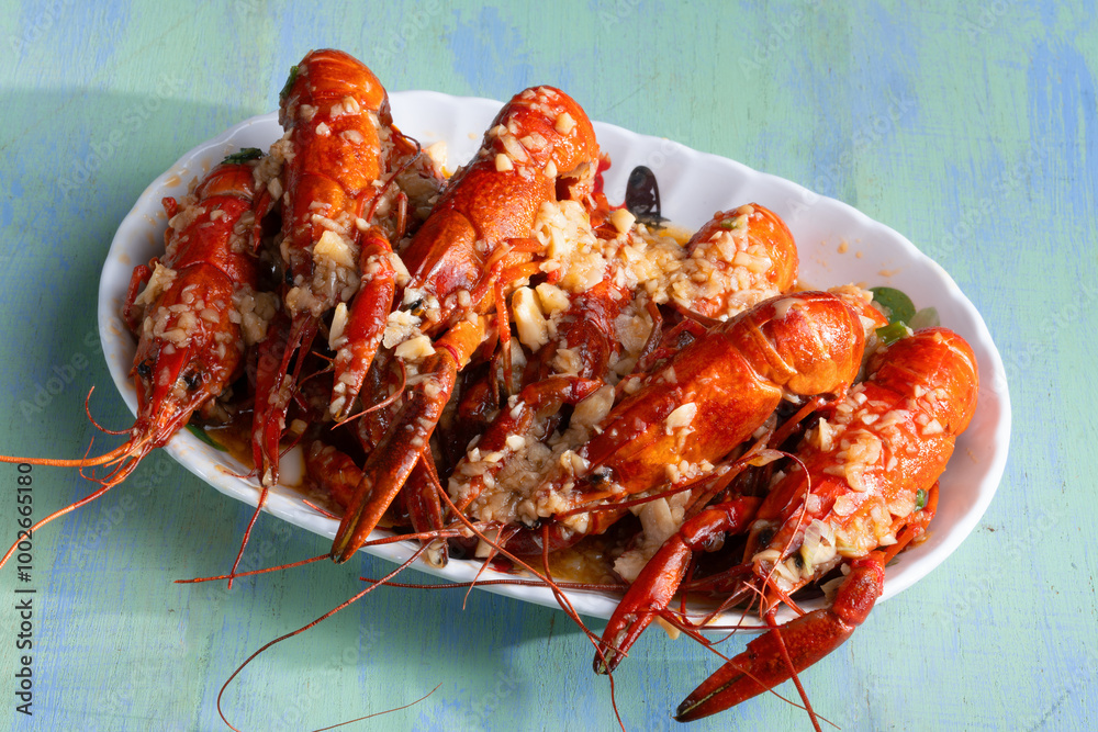 plate of traditional garlicky spicy sichuan red crawfish