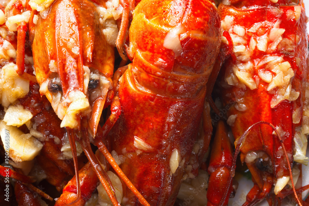 plate of traditional garlicky spicy sichuan red crawfish food background