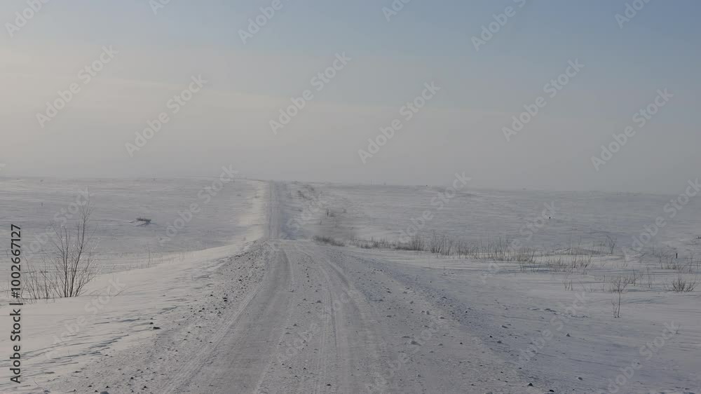 Difficult winter roads in the wide open spaces of Arctic tundra. There is no way here in summer. Russia, Komi Republic oil and gas region, former Soviet Gulag. Siberia Difficult winter roads in the wide open spaces of Arctic tundra. There is no way here in summer. Russia, Komi Republic oil and gas region, former Soviet Gulag. Siberia