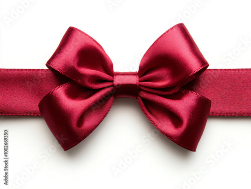 Decorative shiny atlas red ribbon with bow isolated on white background. Red band satin strip for Valentine's, birthday gift. Wrapping for Christmas party, Father's, Women's day  gift. Black friday  photo