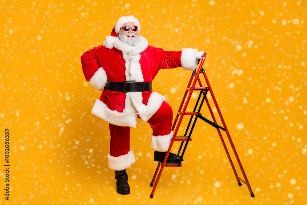 Full size photo of funny funky santa claus in red hat want climb stairs to deliver dream wish gift presents on magic christmas x-mas night isolated over shine color background Full size photo of funny funky santa claus in red hat want climb stairs to deliver dream wish gift presents on magic christmas x-mas night isolated over shine color background