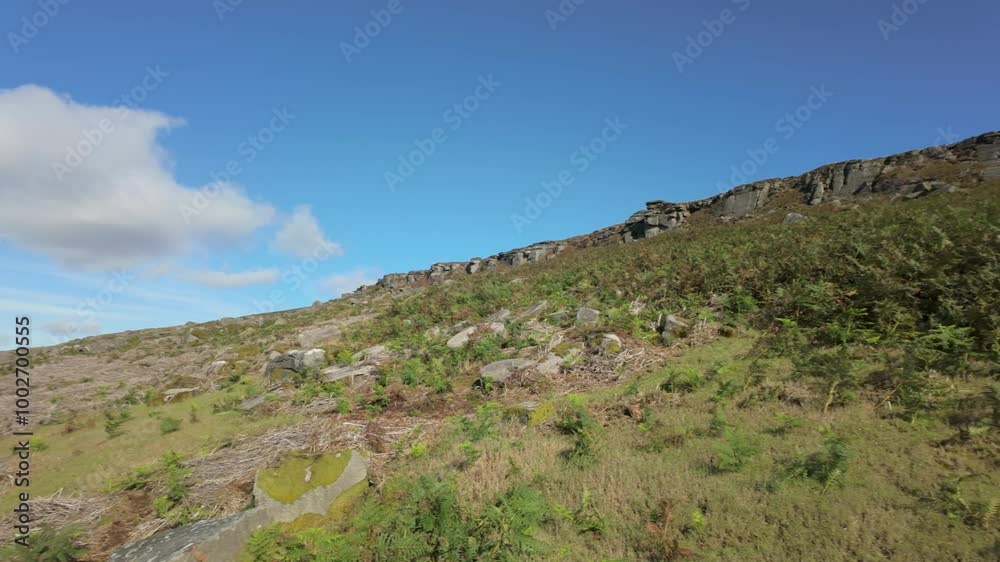 B roll panning shot of the gritstone escarpment of Stanage Edge in the Peak District National Park, England. B roll panning shot of the gritstone escarpment of Stanage Edge in the Peak District National Park, England.